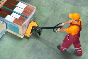 bigstock worker with fork pallet truck 42821026 300x200